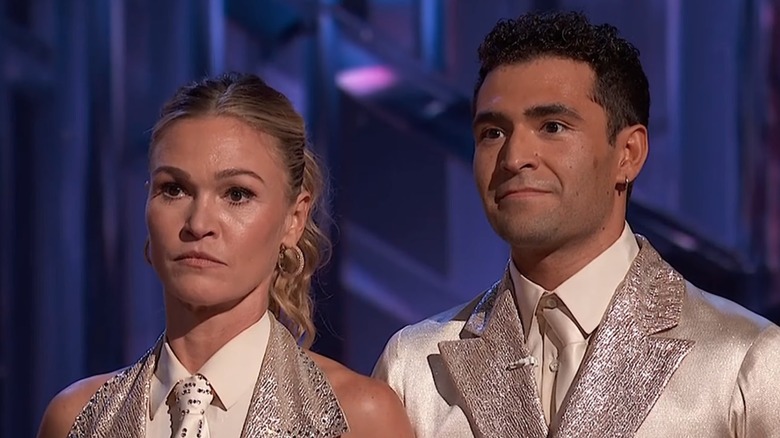Julia Stiles and Ezra Sosa listening to the judges opinions of their dance on 