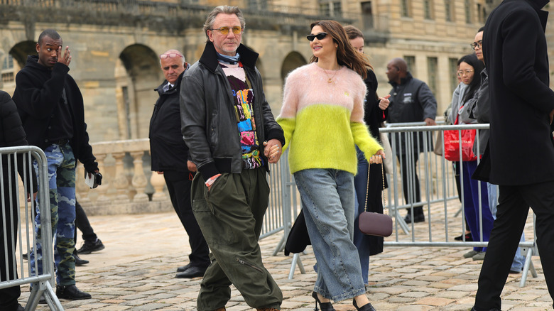 Daniel Craig holds Rachel Weisz's hand