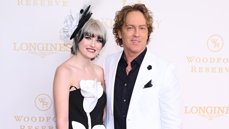 Dannielynn and Larry Birkhead smiling while posing together at the 2026 Kentucky Derby