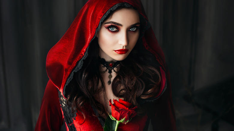 Woman in dark red cottagecore aesthetic