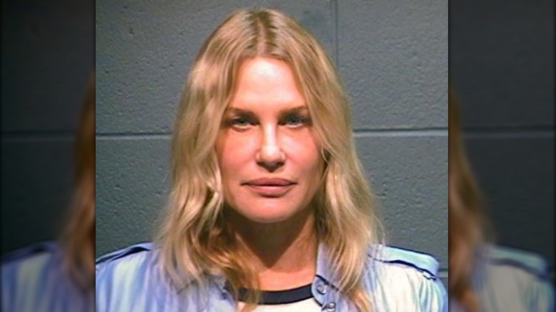 Daryl Hannah stares into the camera in a mug shot after her arrest