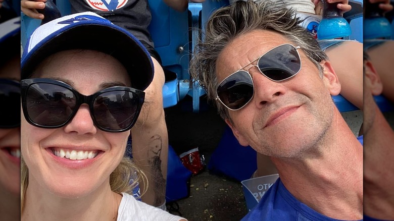 Jefferson Brown and his wife smiling at a baseball game