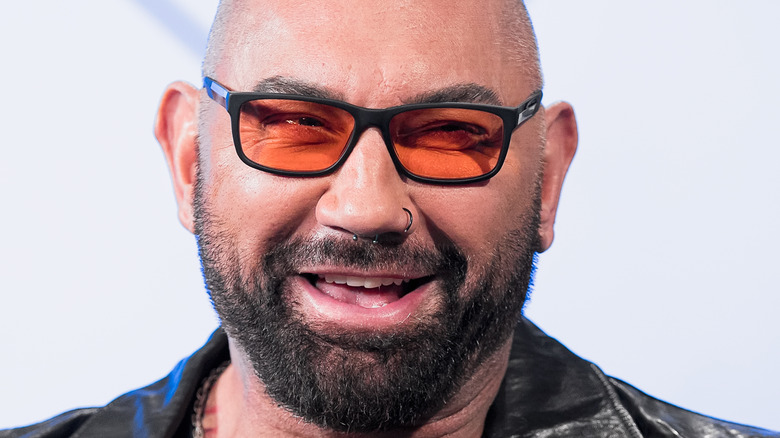 Dave Bautista laughs during a press conference