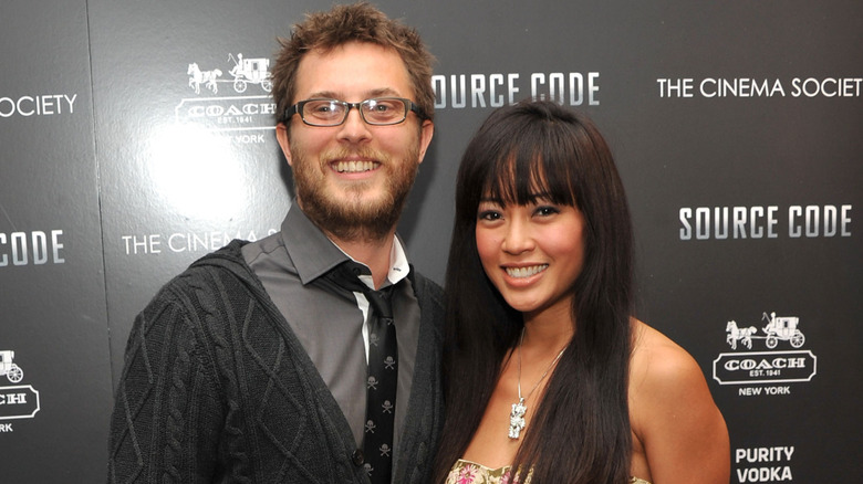 Duncan Jones and Rodene Ronquillo smiling at Source Code premiere