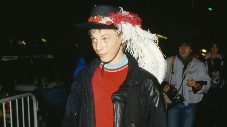 Duncan Jones wearing a hat with feathers