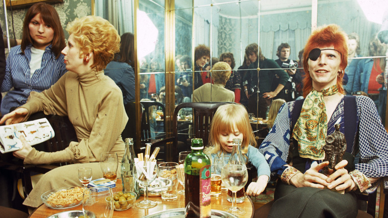 Duncan Jones sitting in between Angie and David Bowie