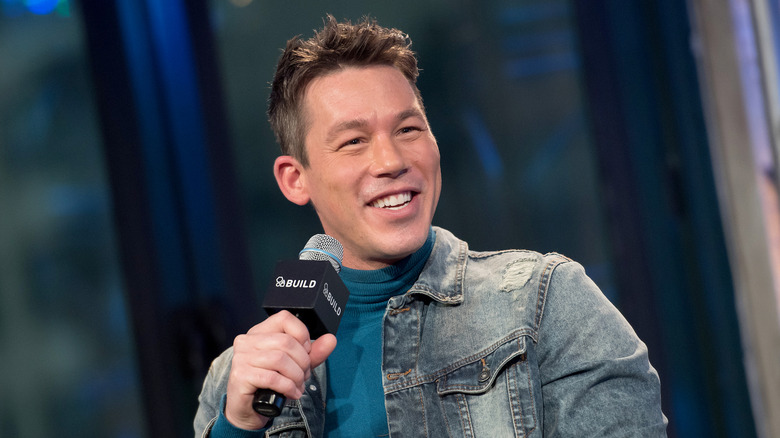 David Bromstad holding a microphone