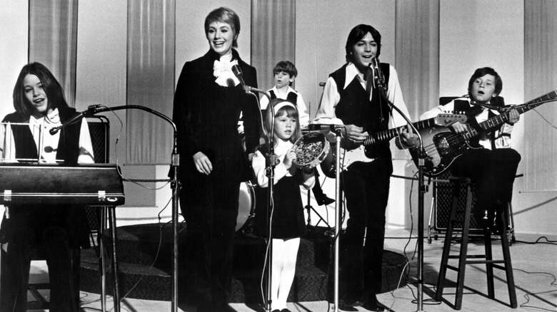 Black-and-white photo of 'The Partridge Family' cast performing onstage