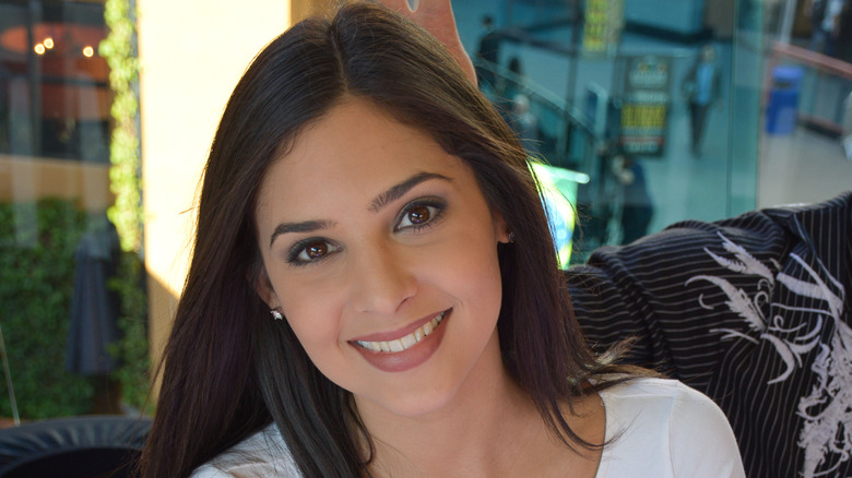 Camila Banus smiling at an event.