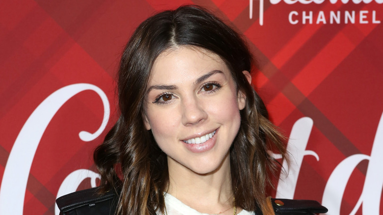 Kate Mansi poses at an event
