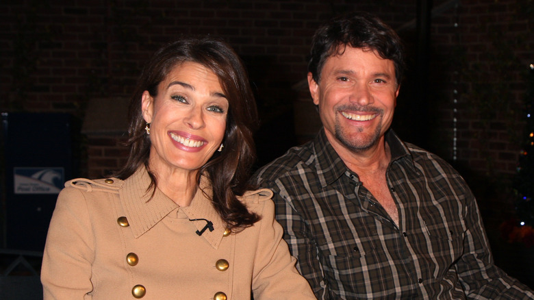 Peter Reckell and Kristian Alfonso smile for a photo. 