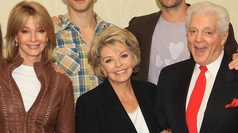 Days of Our Lives cast members smiling for a photo. 
