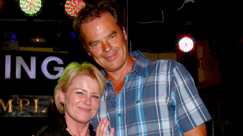 Judi Evans and Wally Kurth smiling.