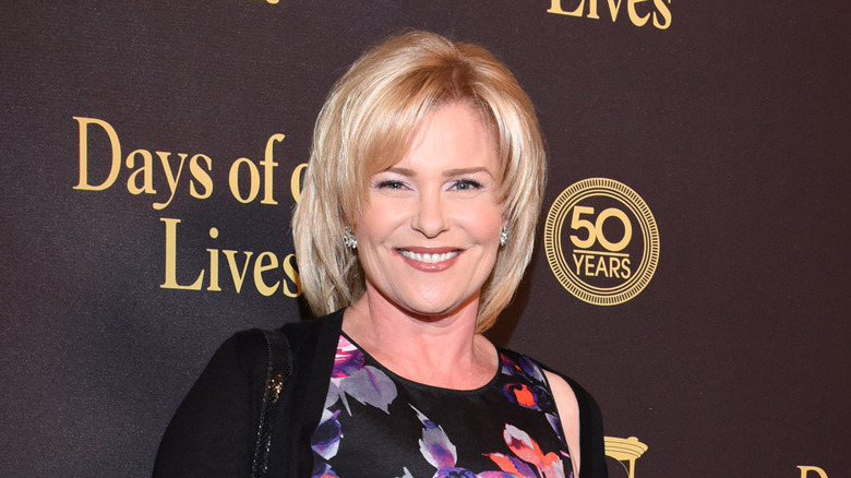 Judi Evans poses for a photo at an event 