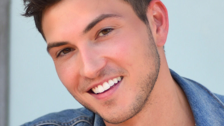 Robert Scott Wilson smiles for a photo. 