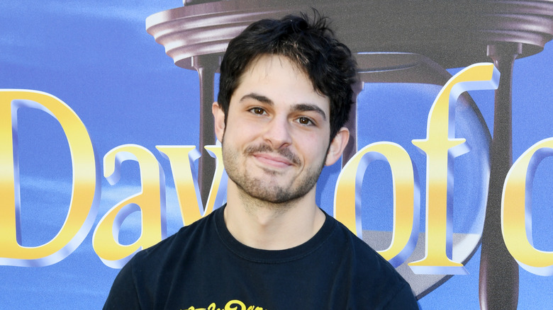 Zach Tinker in front of Days of Our Lives banner