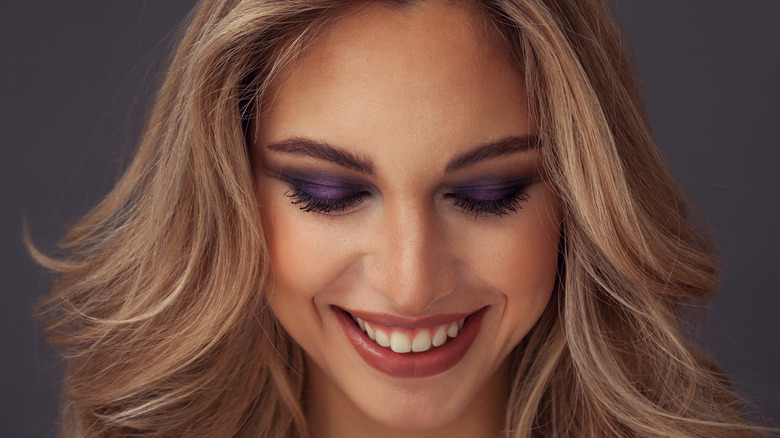 A woman wearing purple eyeshadow