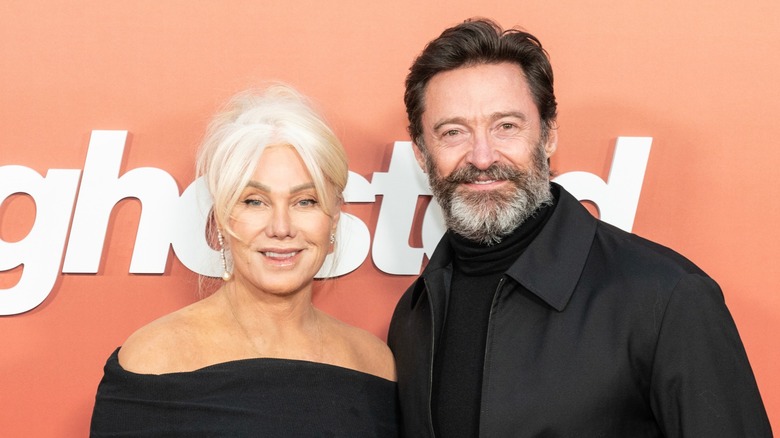 Deborra-Lee Furness and Hugh Jackman smiling, wearing all black (2023)