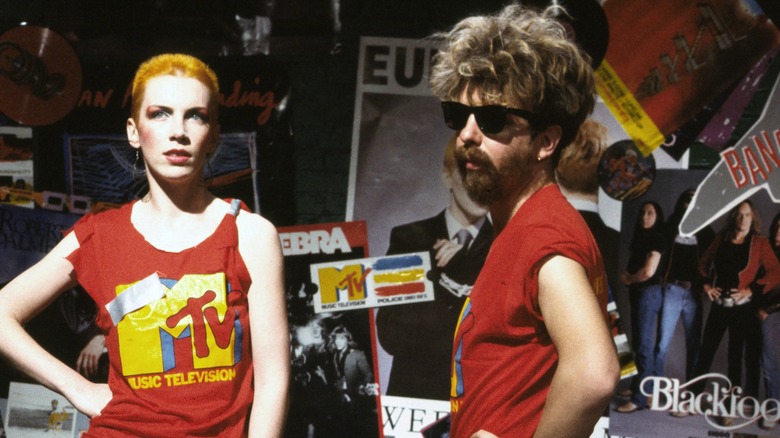 Annie Lennox and Dave Stewart from Eurythmics posing with MTV merch