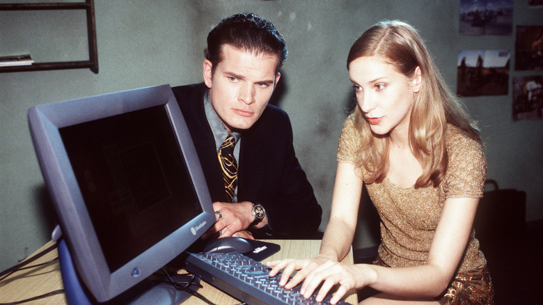 Two people sitting in front of a computer