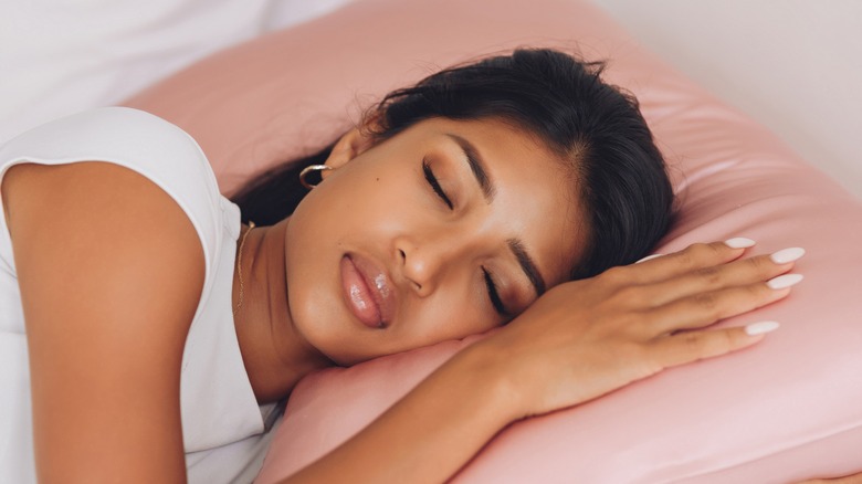 Woman sleeping on silk pillowcase