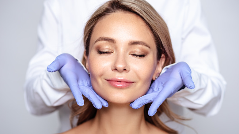 Young woman at the dermatologist