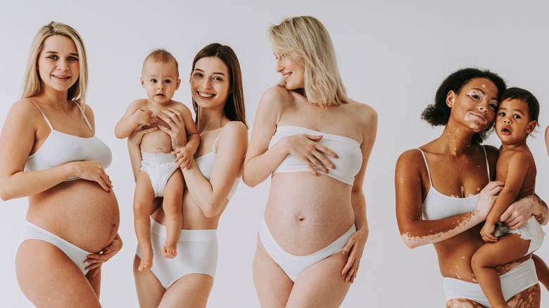 A group of pregnant women with other women carrying children