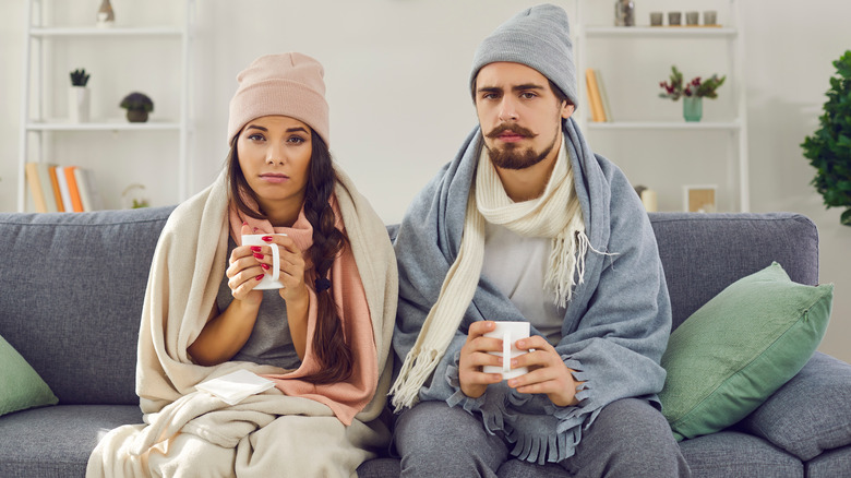 Couple sitting in warm clothes