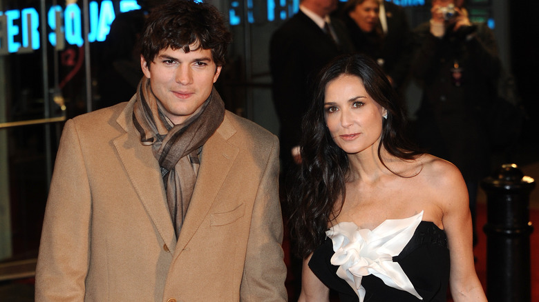 Ashton Kutcher and Demi Moore posing