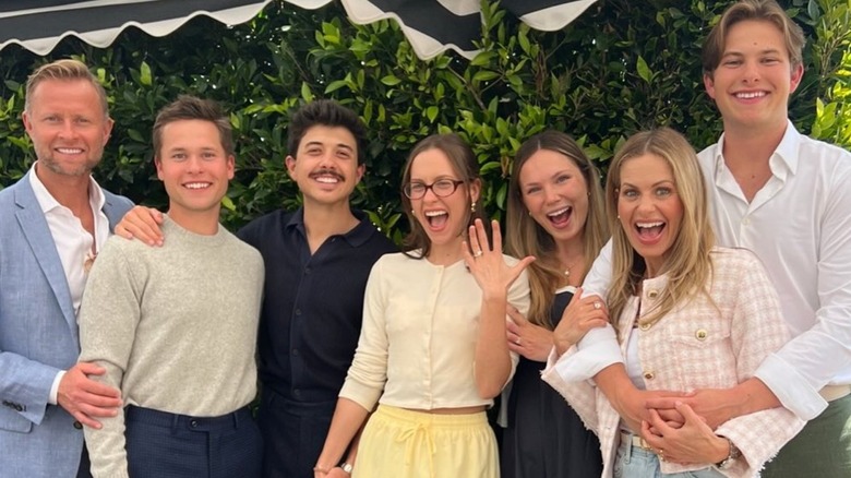 Bradley Steven Perry and Natasha Bure celebrating their engagement with family, April 2025