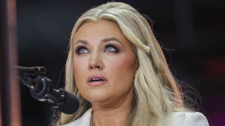 Erika Kirk speaking at a podium