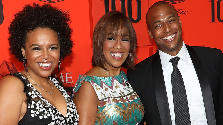 Gayle King, Kirby, and William Bumpus smiling