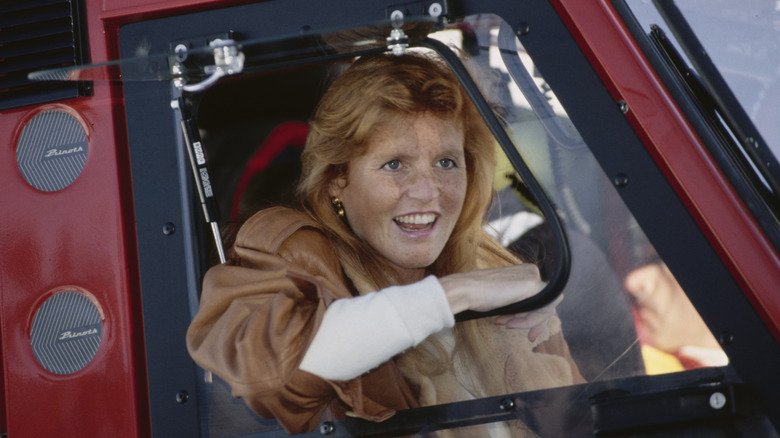 Sarah Ferguson smiling through open vehicle window