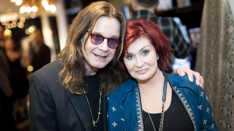 Ozzy Osbourne arm around Sharon Osbourne
