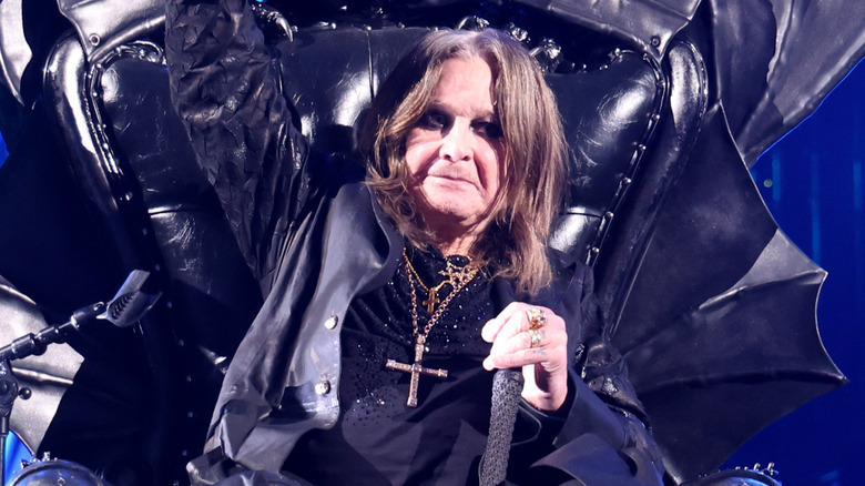 Ozzy Osbourne sitting on black throne