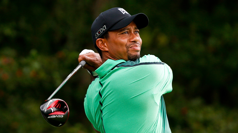 Tiger Woods swinging golf club