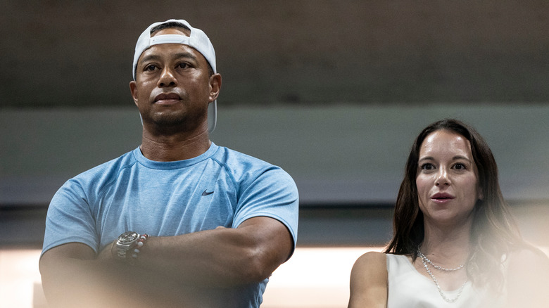 Erica Herman and Tiger Woods in blue