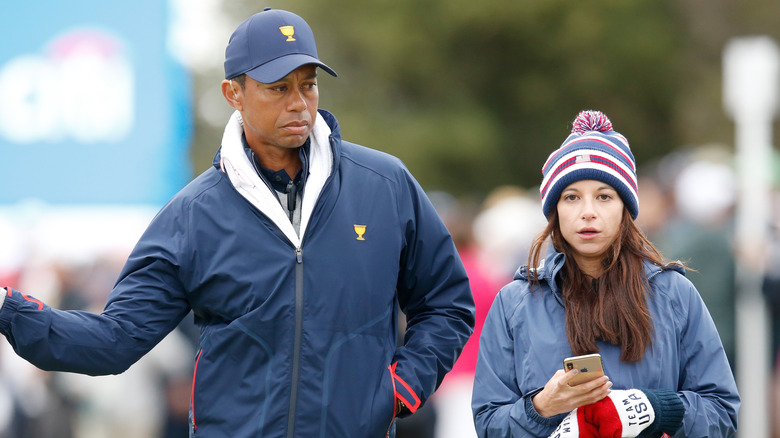Tiger Woods and Erica Herman walking