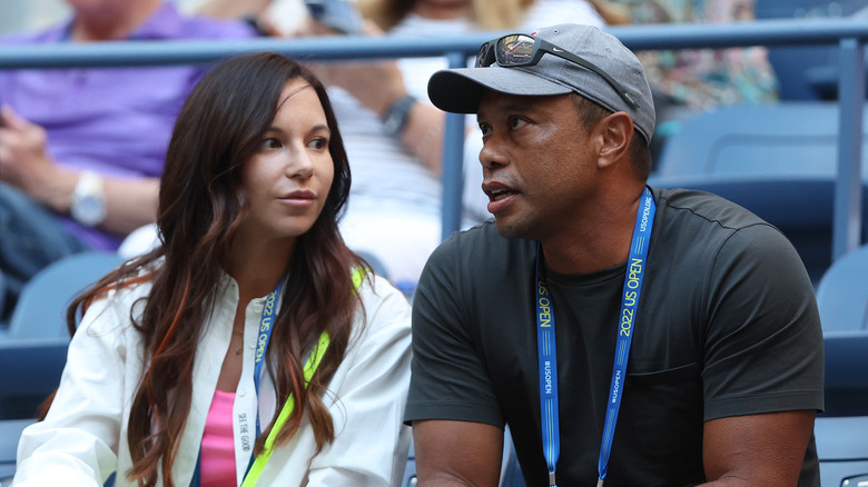 Erica Herman looking at Tiger Woods