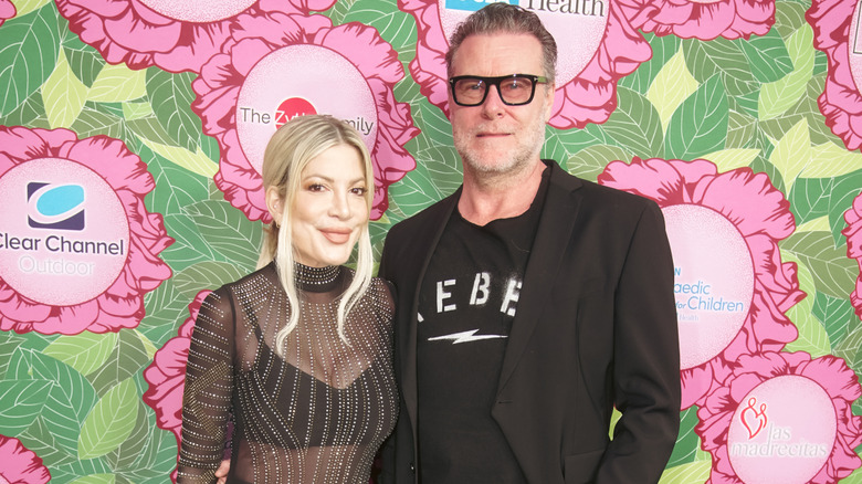 Tori Spelling and Dean McDermott wearing black