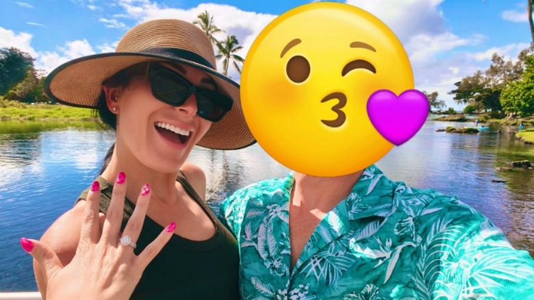 Laura Loomer poses with her fiancé, she shows off her wedding ring, he has an emoji for a face (2025)