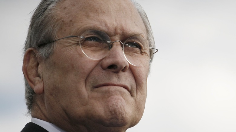 Donald Rumsfeld looking in the distance