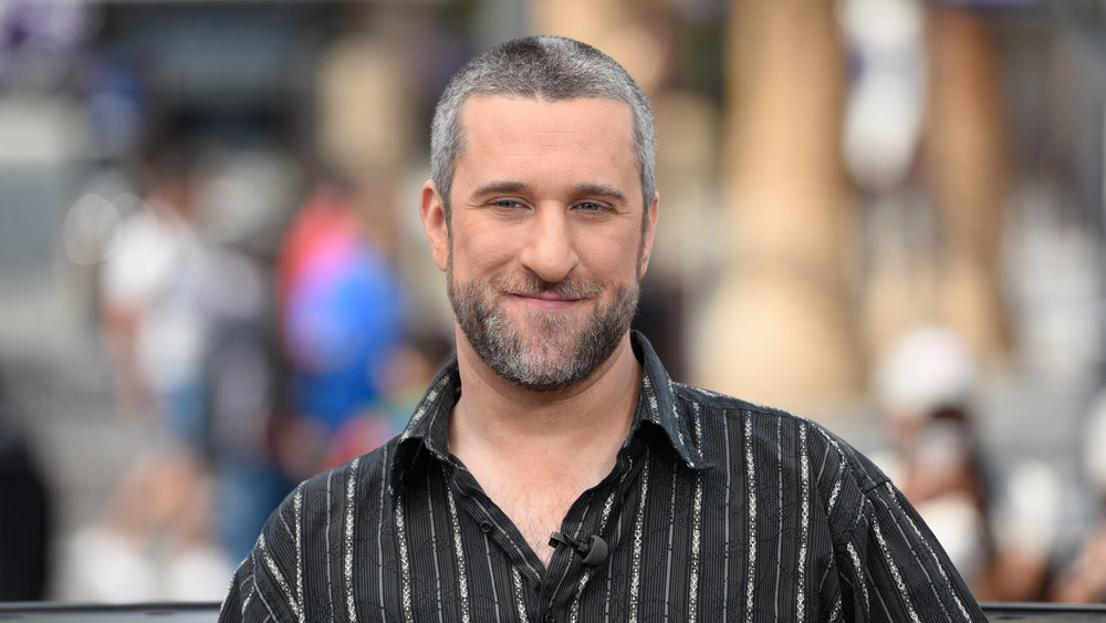 Dustin Diamond smiling at outdoor event