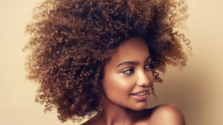 Black woman with curly afro