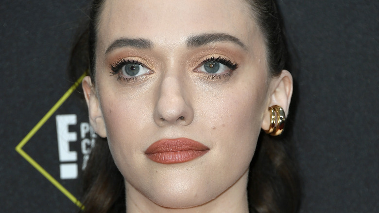 Kat Dennings posing on red carpet 