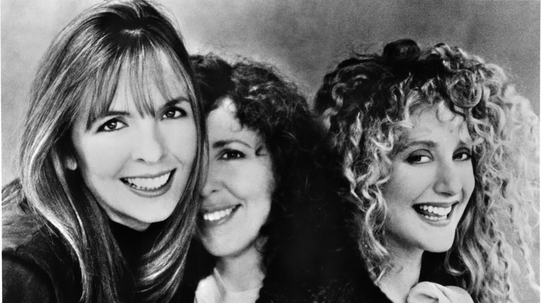 Diane Keaton in black and white alongside two actors.