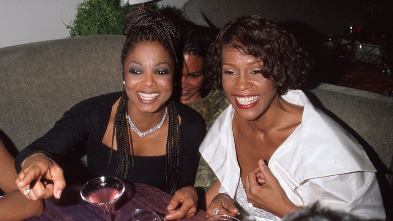 Janet Jackson and Whitney Houston smiling