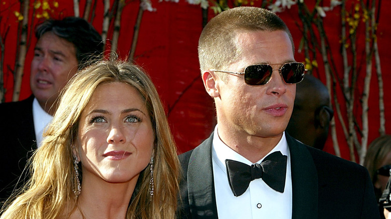 Jennifer Aniston and Brad Pitt posing for photos