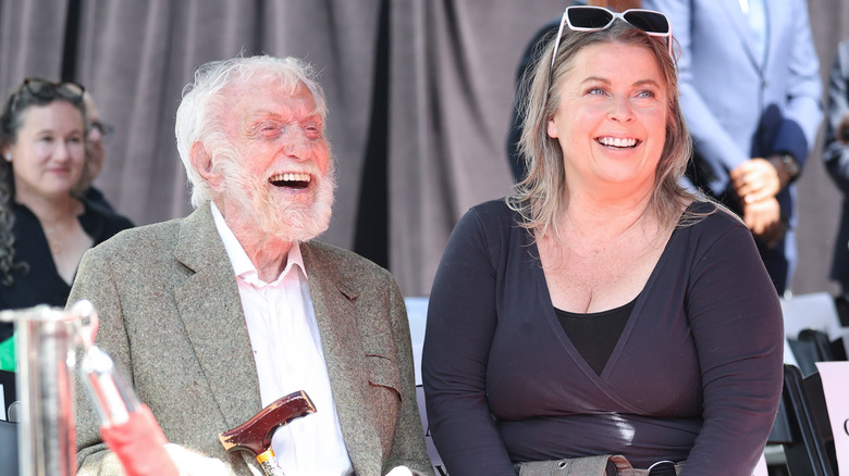 Dick Van Dyke and Arlene Silver sitting down and laughing