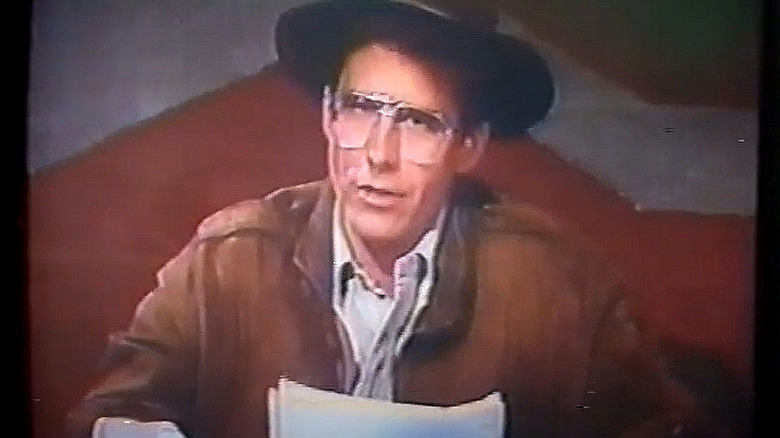 Shep Casey reporting the news on TV